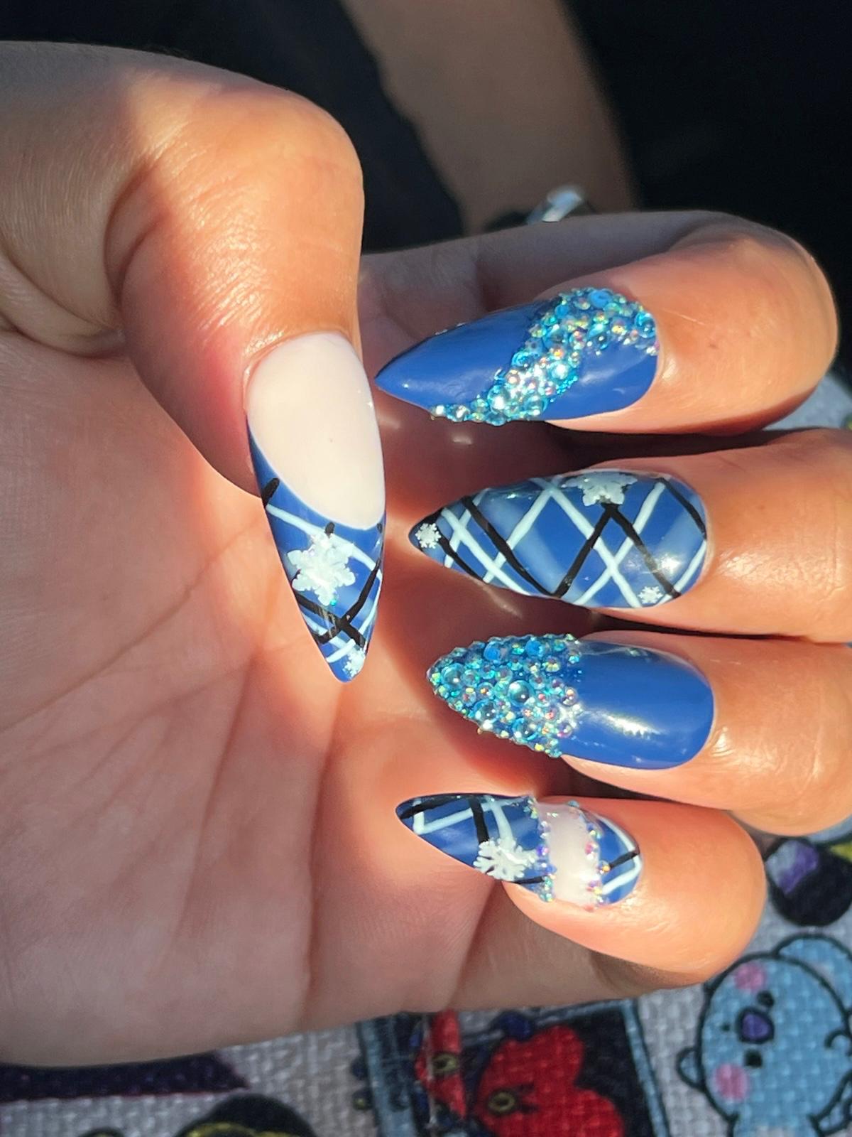 Medium Almond with blue and nude bedazzled Christmas themed nails